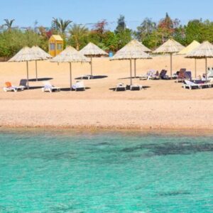 "Shat Al Aqaba - A beautiful view of Aqaba's coastline with clear blue waters and sandy beaches."