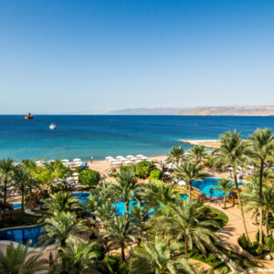 Alt Text for Intercontinental Aqaba Hotel: "Exterior view of the luxurious Intercontinental Hotel in Aqaba, showcasing its modern architecture and beautiful coastal surroundings."